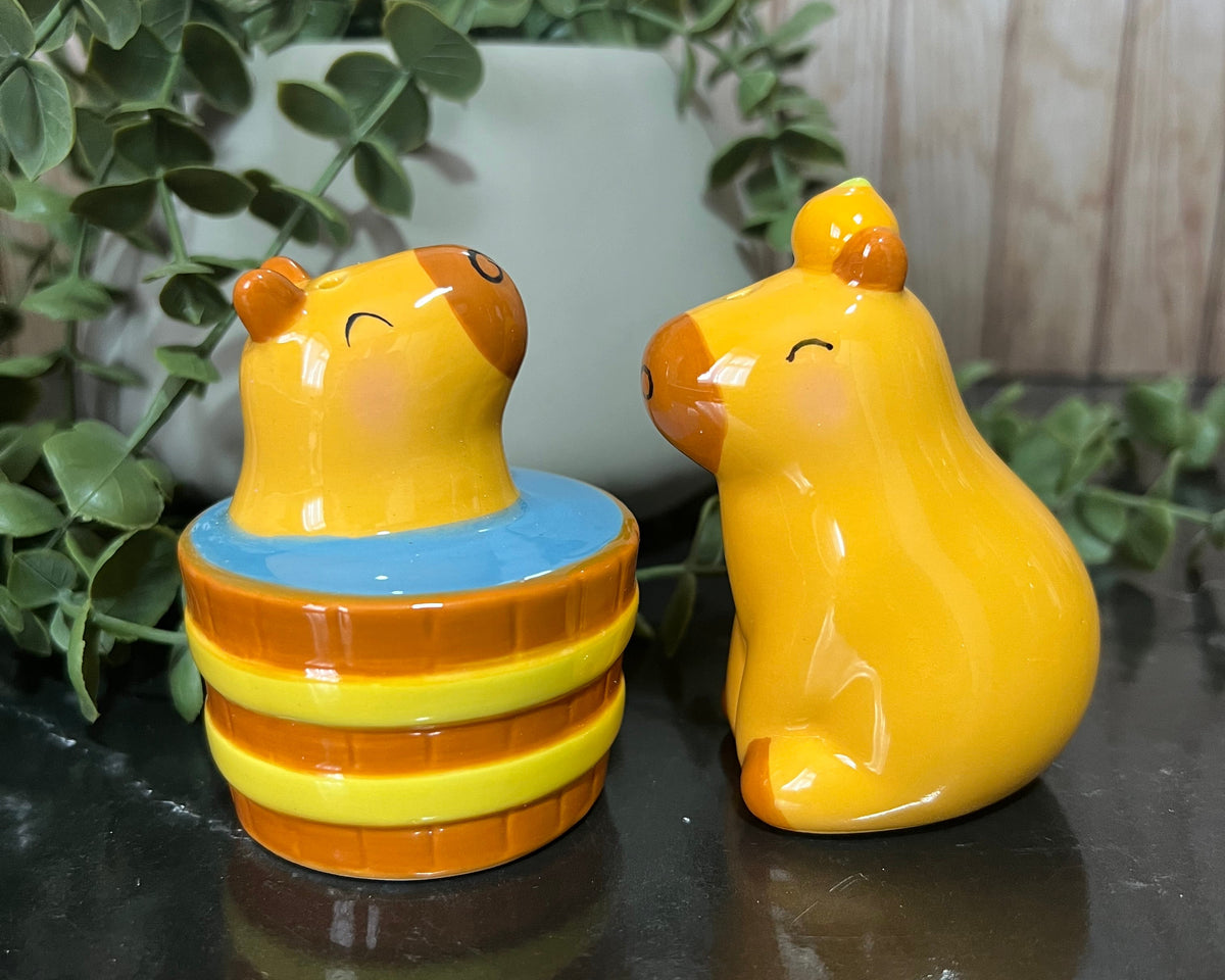 CapyBara salt and pepper shakers in a playful design, featuring a capybara in a barrel and another capybara.